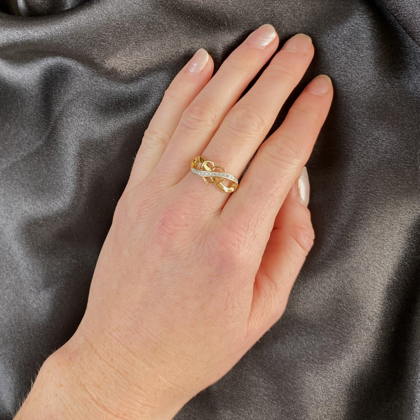 1/6cttw Diamond Infinity Heart Ring in 14K Yellow Gold Plated Sterling Silver