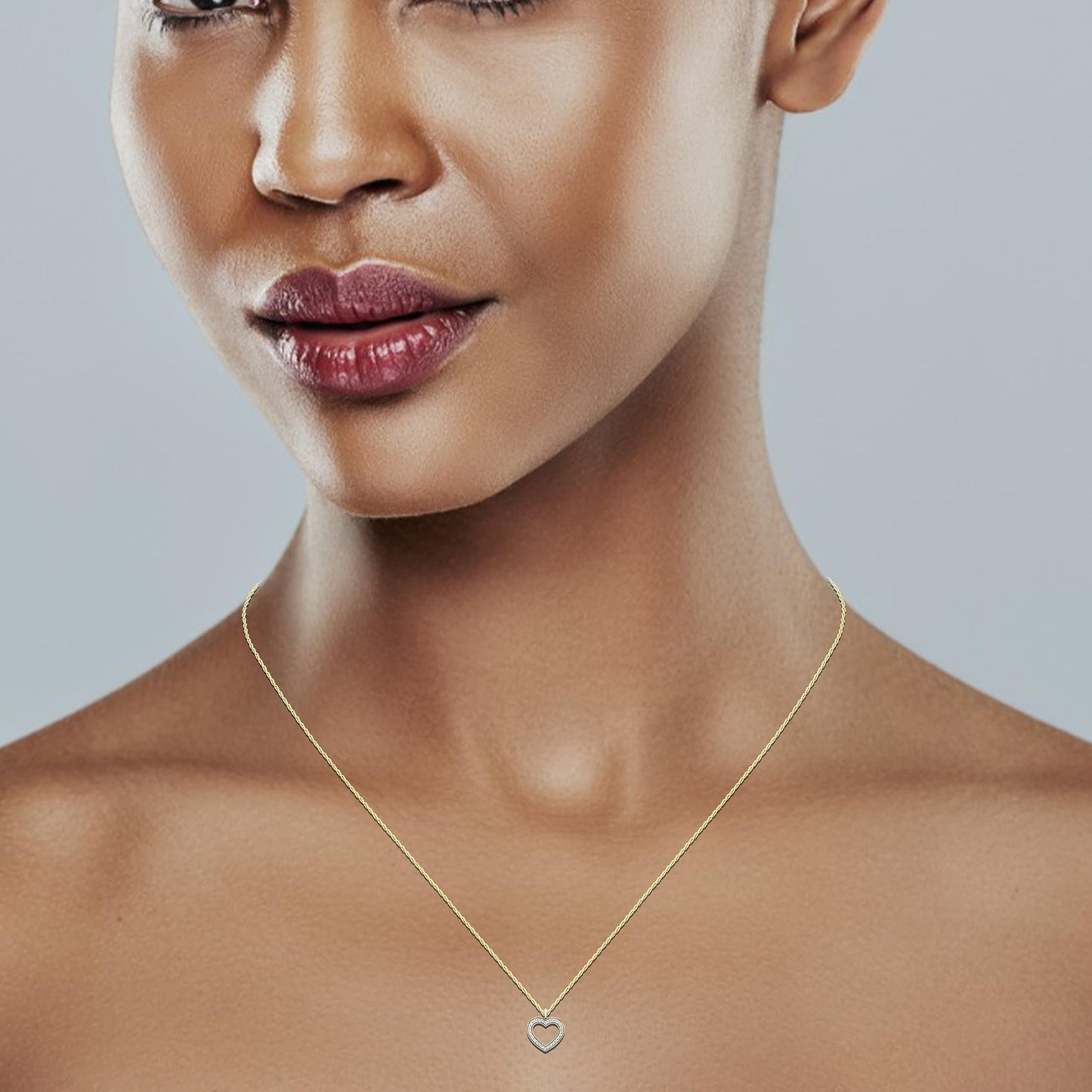 1/5cttw Diamond Open Heart Pendant in 14K Yellow Gold Plated Sterling Silver